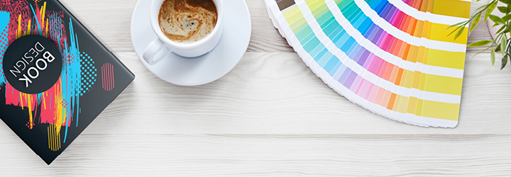 desk with book and colorful swatches