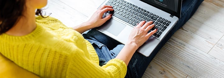 woman typing on laptop